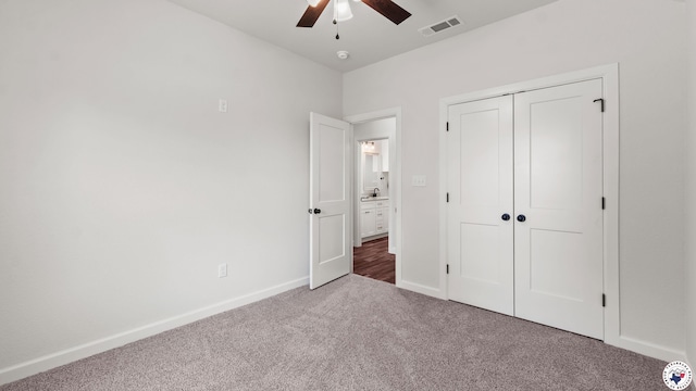 206 Spencer St, Maud, TX 75567 - unfurnished bedroom with carpet flooring, a closet, and ceiling fan