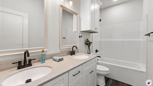 206 Spencer St, Maud, TX 75567 - bathroom with double vanity, wood finished floors, and shower / tub combination