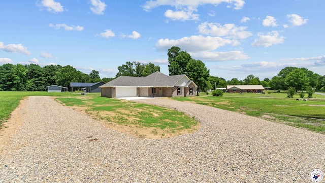 206 Spencer St, Maud, TX 75567 - view of front of house with driveway, a garage, a front yard, and brick siding