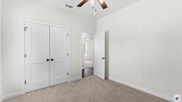 206 Spencer St, Maud, TX 75567 - unfurnished bedroom featuring carpet, a closet, and a ceiling fan