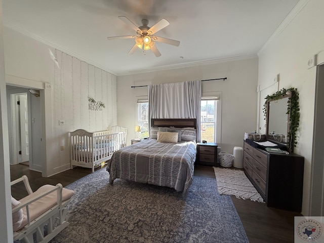 bedroom featuring ornamental molding, ceiling fan, baseboards, and wood finished floors