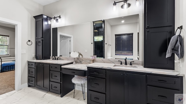 full bath featuring marble finish floor, connected bathroom, and vanity