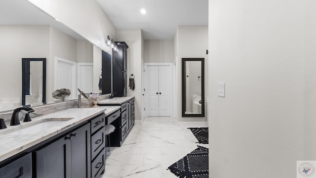 full bath featuring baseboards, marble finish floor, vanity, and recessed lighting