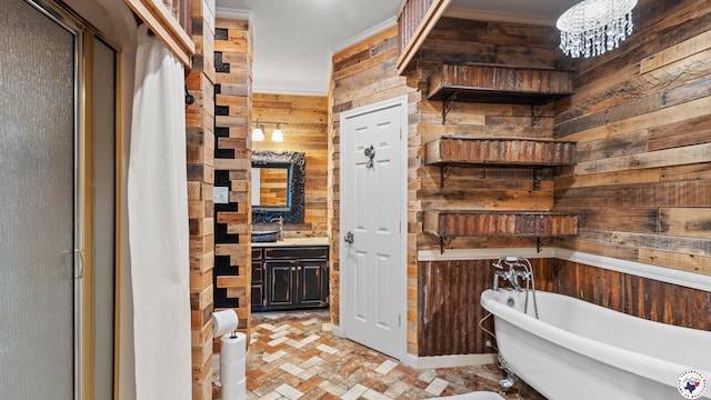 1142 Oakridge Dr, Texarkana, TX 75503 - full bath with wooden walls, a freestanding tub, brick patterned flooring, vanity, and a chandelier