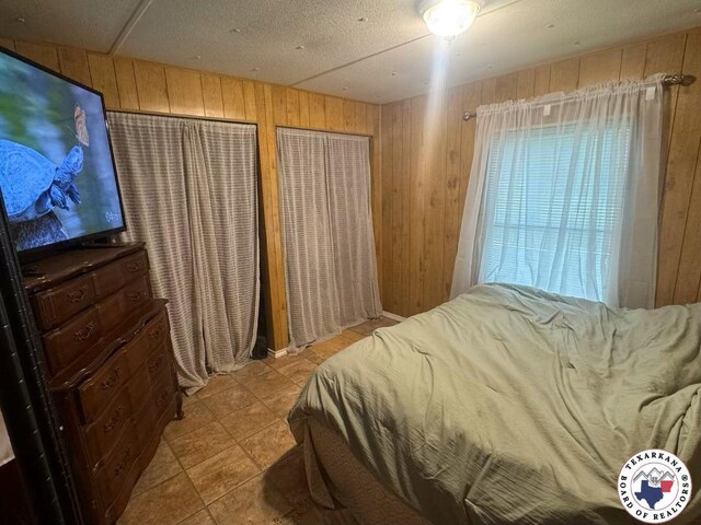 10720W.7TH Trexler Rd, Texarkana, TX 75501 - bedroom featuring wooden walls