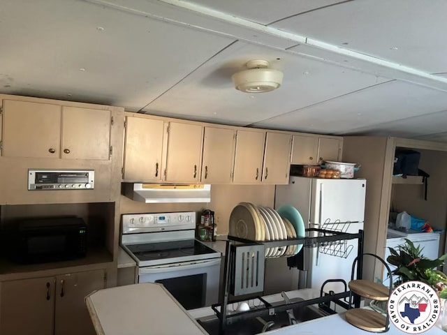 10720W.7TH Trexler Rd, Texarkana, TX 75501 - kitchen featuring white appliances, under cabinet range hood, and cream cabinets