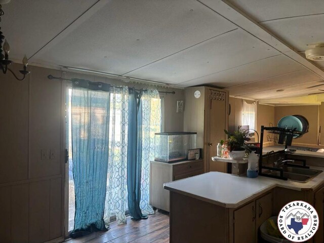 10720W.7TH Trexler Rd, Texarkana, TX 75501 - kitchen with wood finished floors and light countertops