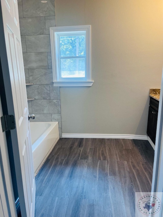 bathroom featuring hardwood / wood-style floors and vanity