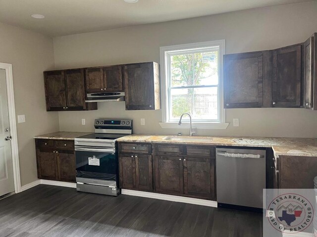 kitchen with sink, stainless steel appliances, dark brown cabinets, and dark hardwood / wood-style floors