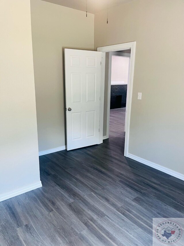 spare room featuring dark hardwood / wood-style floors