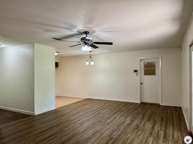 4211 Lotus Dr, Texarkana, TX 75503 - spare room featuring wood finished floors, baseboards, ceiling fan, and a textured ceiling