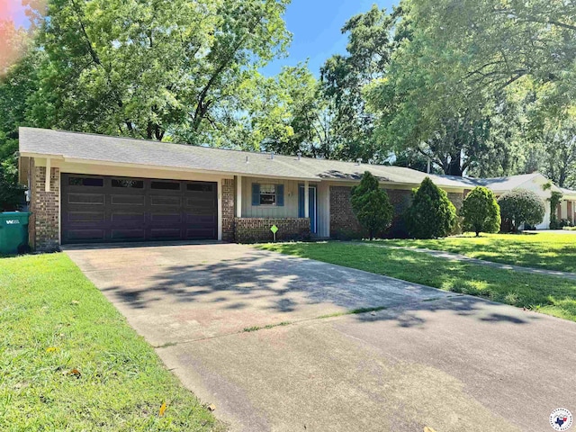 4211 Lotus Dr, Texarkana, TX 75503 - ranch-style home with concrete driveway, brick siding, an attached garage, and a front yard