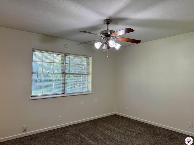4211 Lotus Dr, Texarkana, TX 75503 - empty room with ceiling fan, dark colored carpet, baseboards, and a textured ceiling