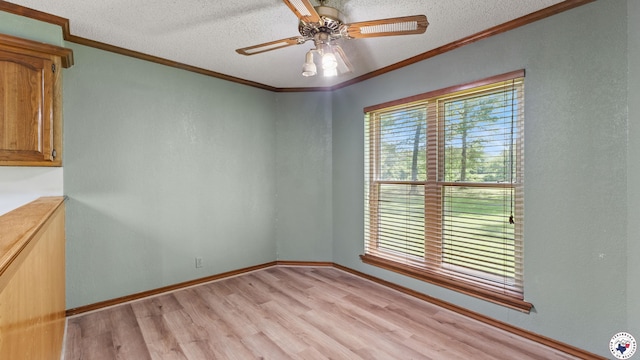 1135 Cook Rd, Texarkana, AR 71854 - empty room featuring light wood-style floors, a textured ceiling, ornamental molding, and a ceiling fan