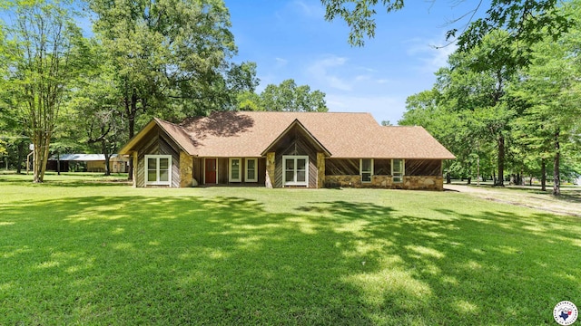 1135 Cook Rd, Texarkana, AR 71854 - view of front of property with a front lawn, stone siding, and roof with shingles