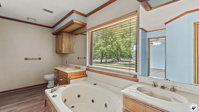 1135 Cook Rd, Texarkana, AR 71854 - bathroom with vanity, wood finished floors, a jetted tub, a textured ceiling, and crown molding