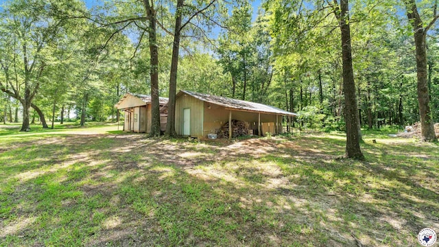 1135 Cook Rd, Texarkana, AR 71854 - view of side of property with an outbuilding