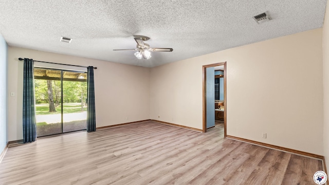 1135 Cook Rd, Texarkana, AR 71854 - spare room featuring light wood-style floors, a ceiling fan, and a textured ceiling