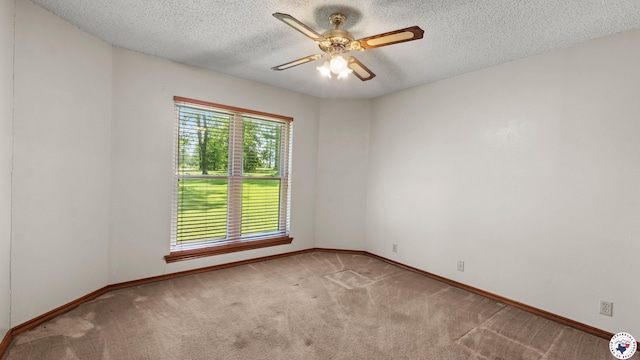 1135 Cook Rd, Texarkana, AR 71854 - unfurnished room featuring carpet floors, ceiling fan, and a textured ceiling