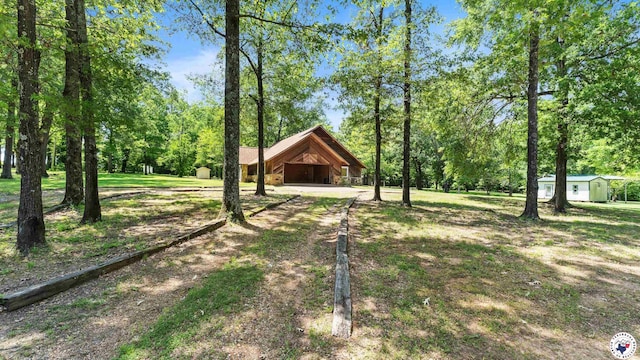 1135 Cook Rd, Texarkana, AR 71854 - view of grassy yard with an outbuilding and driveway