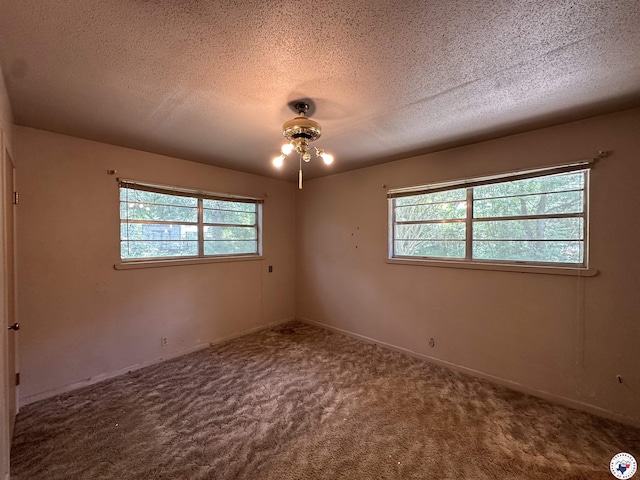 216 W Pioneer St, Wake Village, TX 75501 - unfurnished room featuring carpet floors and a textured ceiling