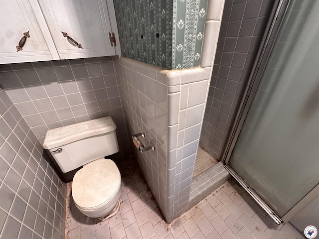 216 W Pioneer St, Wake Village, TX 75501 - bathroom featuring tile walls and a stall shower