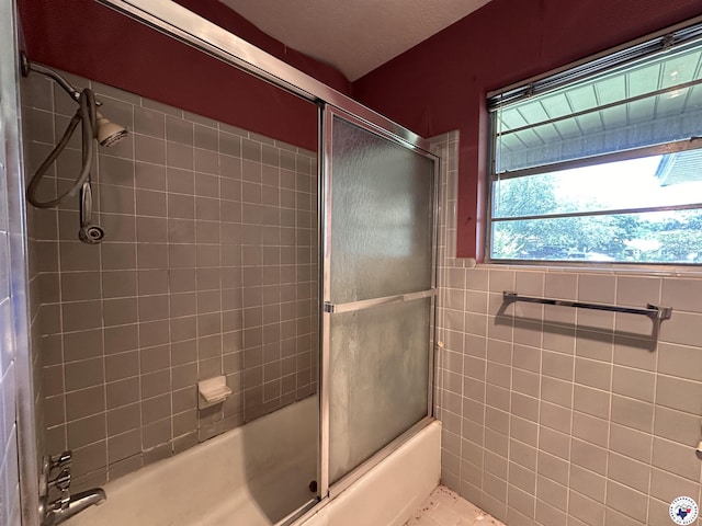 216 W Pioneer St, Wake Village, TX 75501 - bathroom featuring enclosed tub / shower combo and tile walls