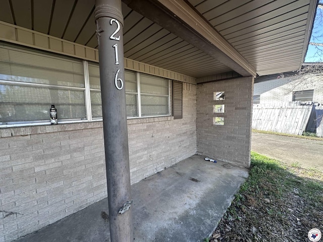 216 W Pioneer St, Wake Village, TX 75501 - exterior view of brick siding and fence