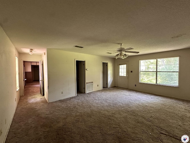 216 W Pioneer St, Wake Village, TX 75501 - spare room with carpet, a ceiling fan, and a textured ceiling