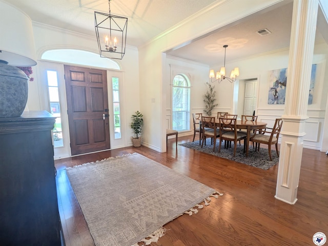 3815 Wyatt Ln, Texarkana, TX 75503 - entryway featuring a chandelier, crown molding, and dark wood-type flooring