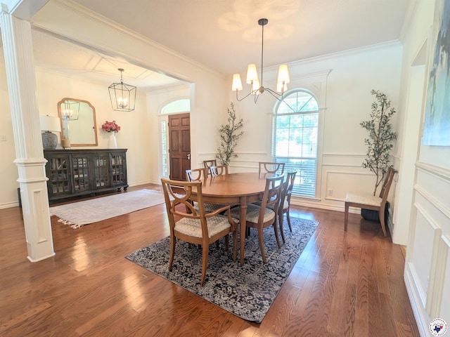 3815 Wyatt Ln, Texarkana, TX 75503 - dining room with a chandelier, dark wood-style floors, ornamental molding, and a decorative wall