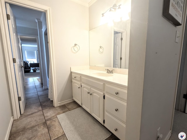 3815 Wyatt Ln, Texarkana, TX 75503 - bathroom with crown molding, vanity, baseboards, and tile patterned flooring