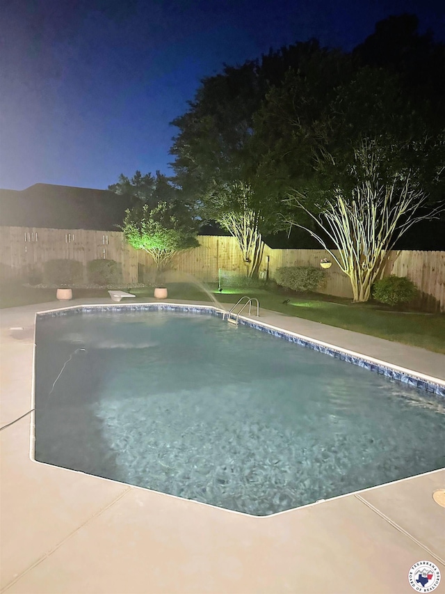 3815 Wyatt Ln, Texarkana, TX 75503 - pool at twilight featuring a fenced backyard