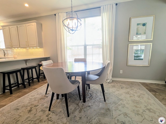 3815 Wyatt Ln, Texarkana, TX 75503 - dining space with a chandelier, ornamental molding, baseboards, and recessed lighting