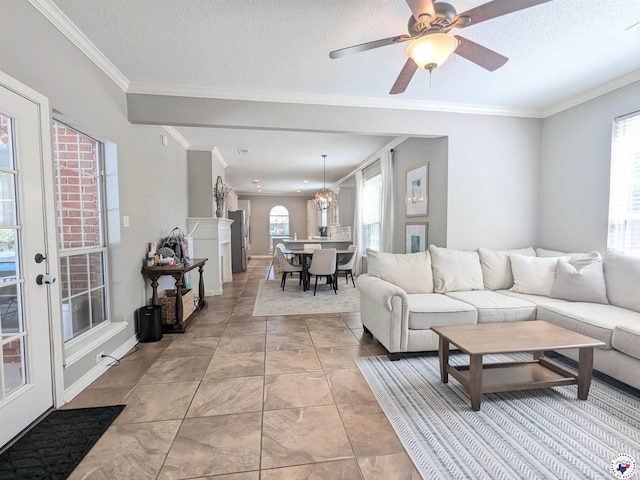 3815 Wyatt Ln, Texarkana, TX 75503 - living room featuring ornamental molding, baseboards, ceiling fan, and a textured ceiling