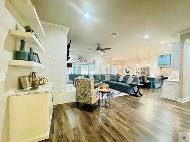 living area with ceiling fan, visible vents, ornamental molding, and dark wood-style flooring