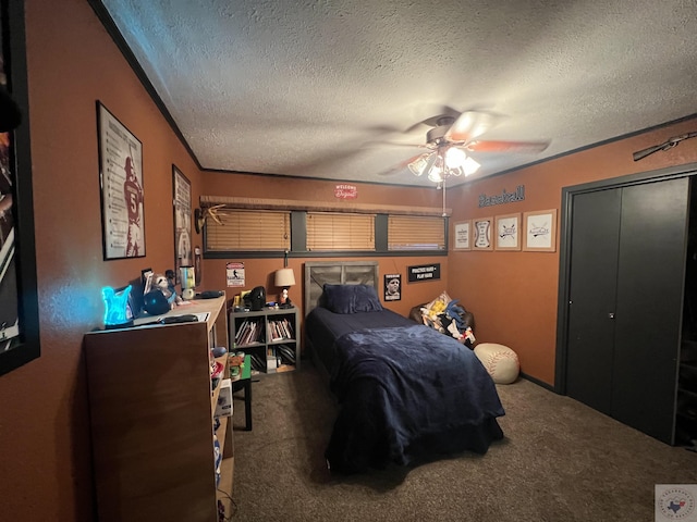 bedroom with carpet floors and a textured ceiling