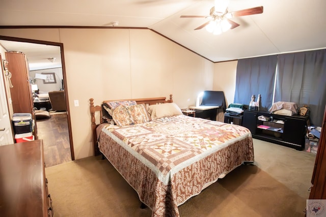 bedroom with vaulted ceiling and a ceiling fan