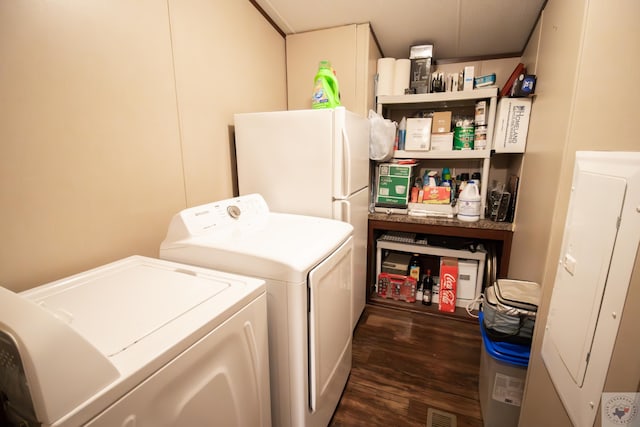 laundry room featuring laundry area, dark wood-style floors, visible vents, and washer and clothes dryer