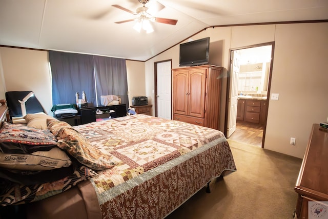 bedroom with light colored carpet, a ceiling fan, ensuite bathroom, and lofted ceiling