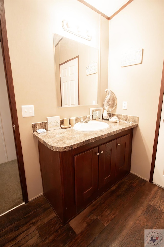 bathroom with vanity and wood finished floors