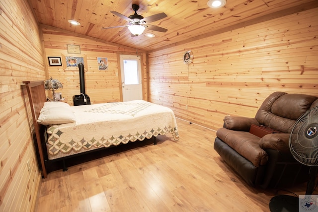 bedroom with recessed lighting, vaulted ceiling, hardwood / wood-style flooring, wood ceiling, and wood walls