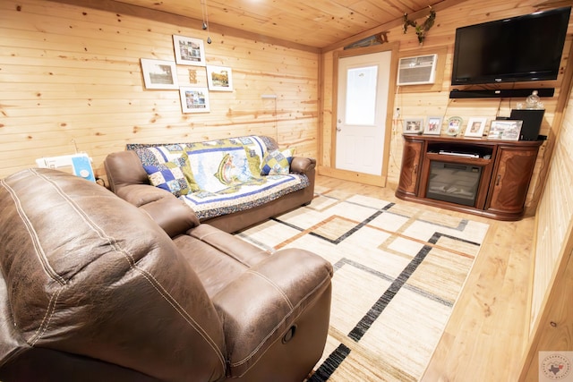 living room with wood walls, wood ceiling, a wall mounted AC, and lofted ceiling