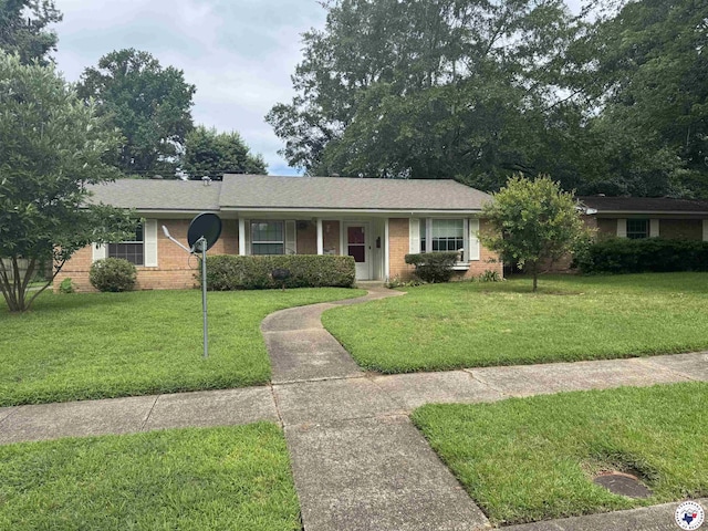3811 Potomac Ave, Texarkana, TX 75501 - ranch-style house featuring brick siding and a front yard