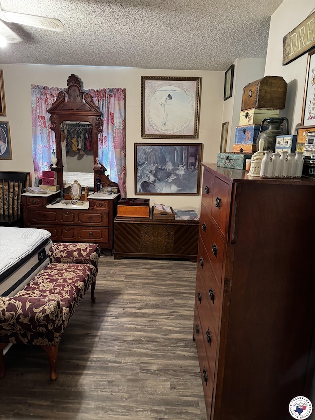 3811 Potomac Ave, Texarkana, TX 75501 - bedroom with a textured ceiling and dark wood-type flooring