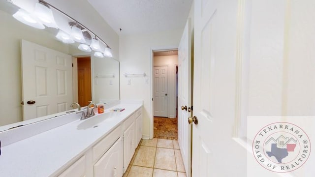 bathroom featuring tile patterned floors and vanity