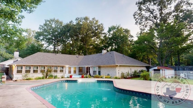 view of swimming pool with a patio area