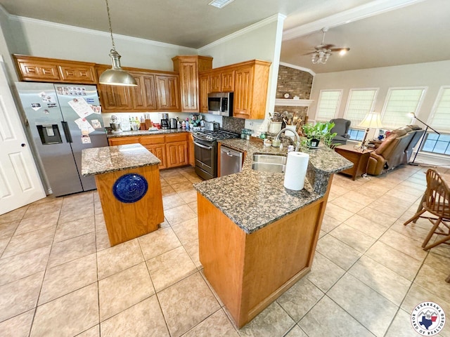 25 County Road 1905, Linden, TX 75563 - kitchen featuring appliances with stainless steel finishes, a sink, a peninsula, a ceiling fan, and brown cabinets