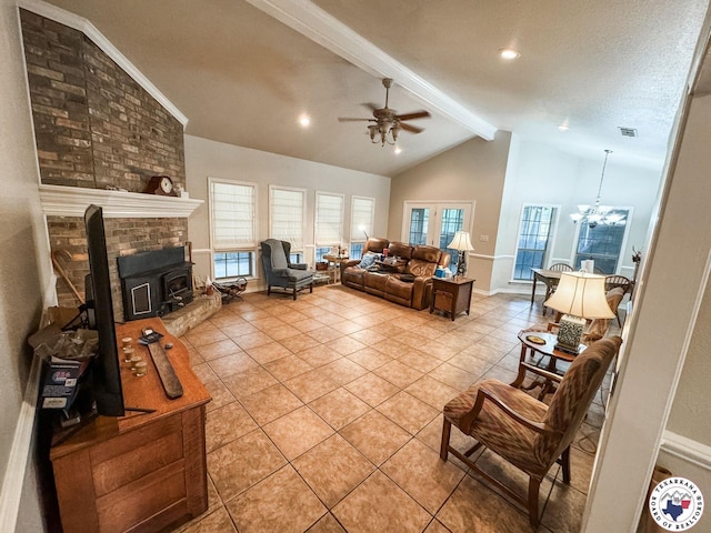 25 County Road 1905, Linden, TX 75563 - living area with a ceiling fan, light tile patterned floors, beam ceiling, baseboards, and high vaulted ceiling
