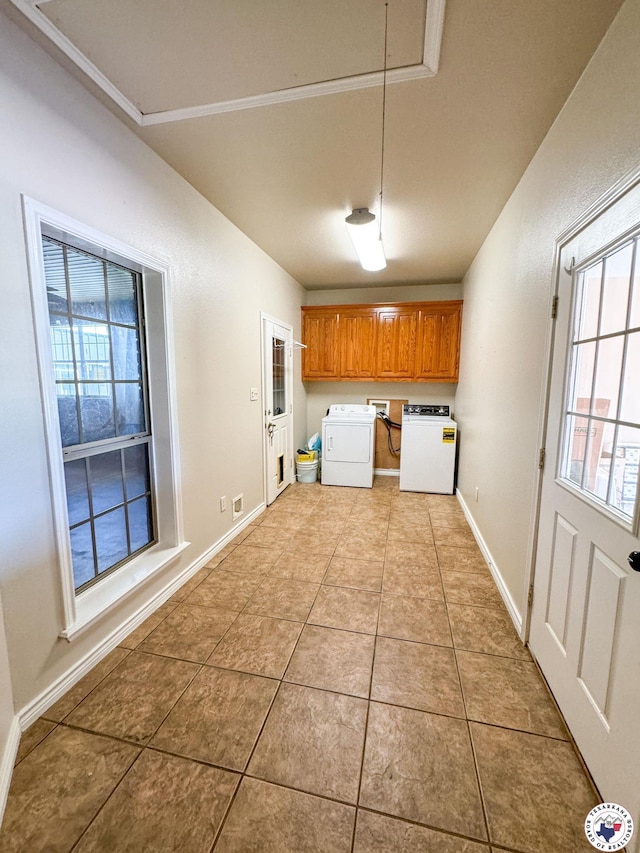 25 County Road 1905, Linden, TX 75563 - kitchen with brown cabinets, washing machine and clothes dryer, light tile patterned floors, and baseboards